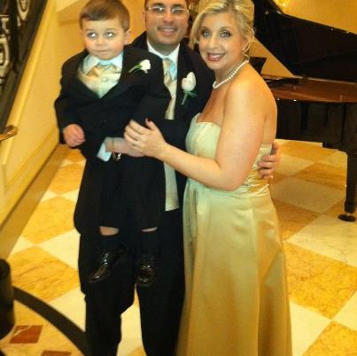 The mom a la mode family --  dressed to the nines in Men's Wearhouse tuxes and  a David's Bridal gown