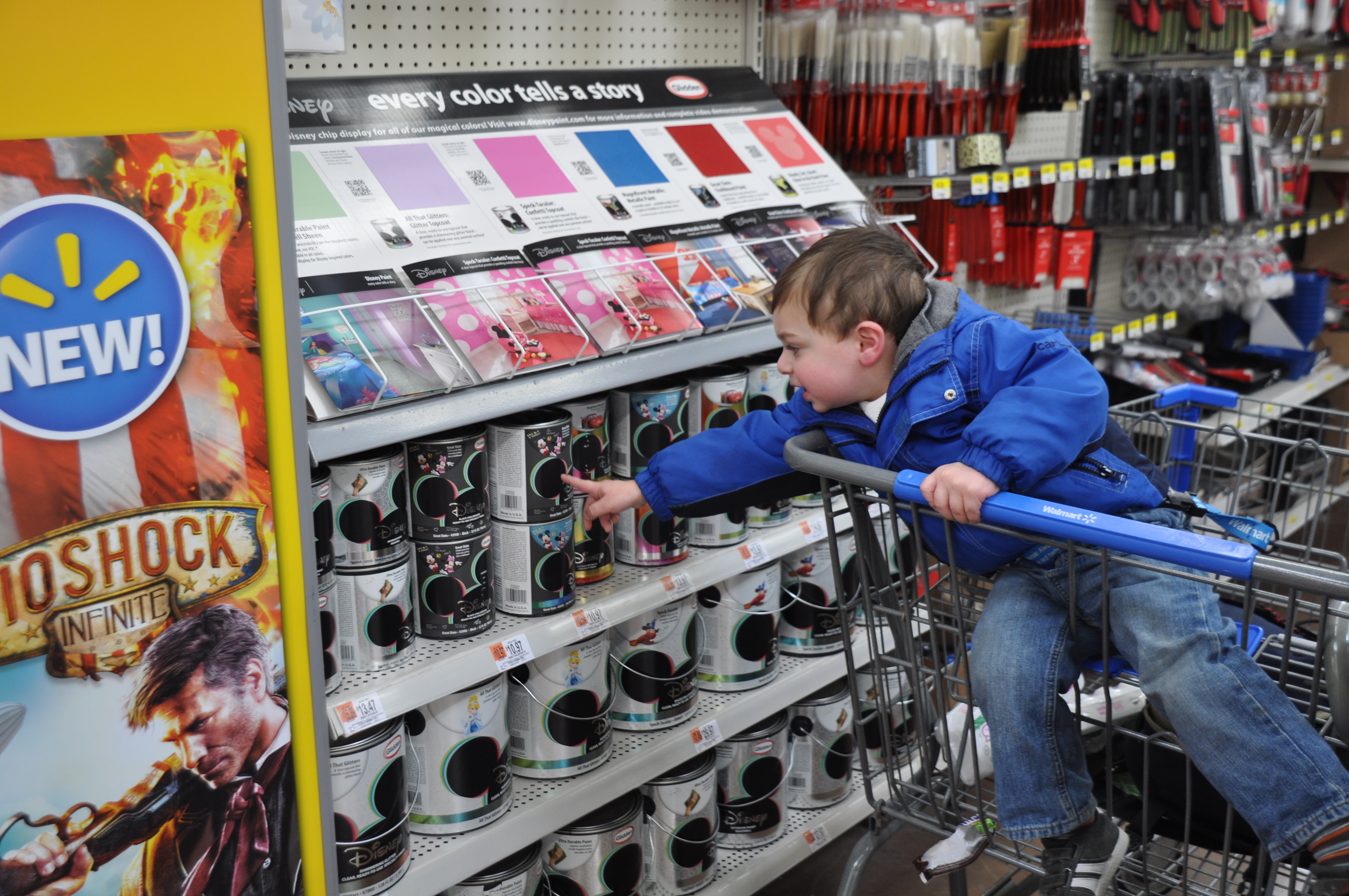 Roc selects his Disney Paint at Walmart.