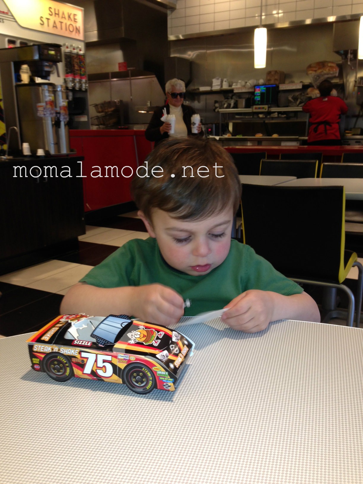Roc at work with his stickers and car