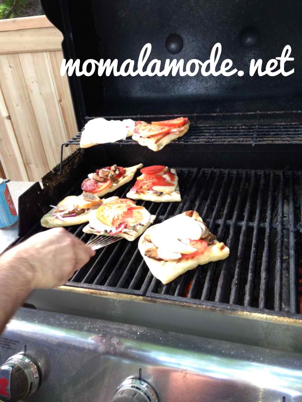 Return topped pizzas to grill and cook until cheeses melt and toppings are warmed through out.