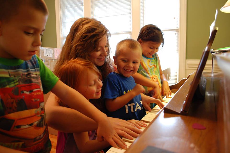 Jenn and her children make music together
