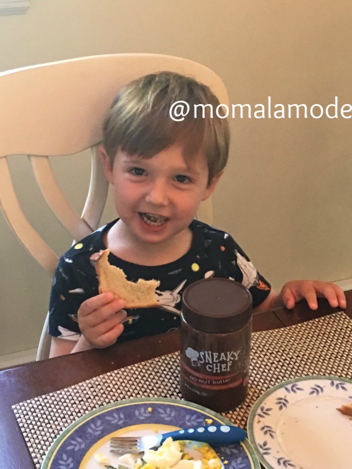 Jackie's son happily enjoying toast with Chocolate No Nut Butter